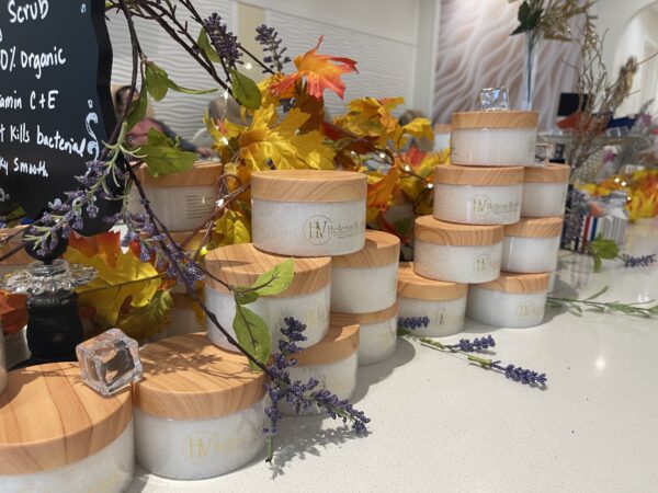 A table with many different containers of beauty products.